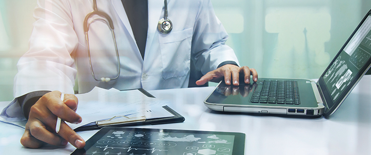 Doctor working on his computer